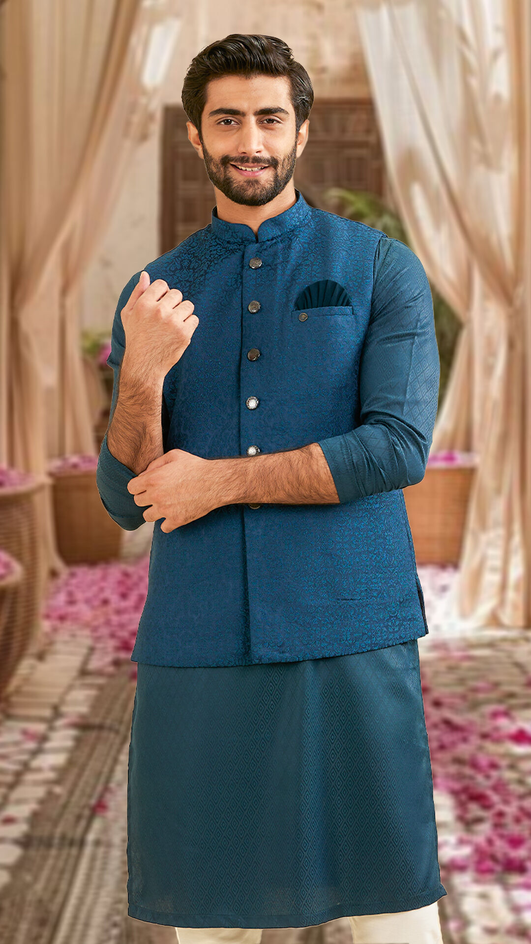 A man wearing a blue achkan sherwani set 